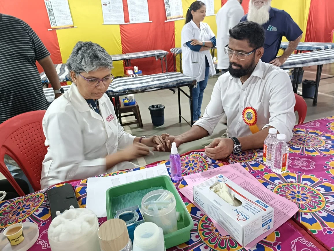 Volunteer Donating Blood Under Doctor Care